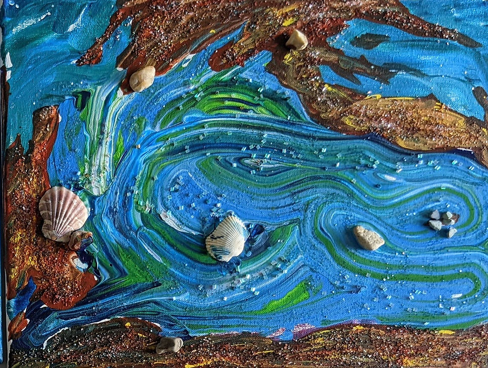 Handcrafted ocean-inspired art made with paint, crushed shells, and sand during an adult art workshop focused on sensory creativity.