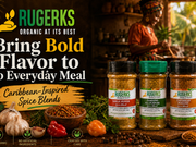 Rugerks® Garlic Pepper, Jamdung All Purpose, and Caribbean Poultry spice blends displayed with garlic, peppers, herbs, and spices as a woman cooks in a warm Caribbean-inspired kitchen.
