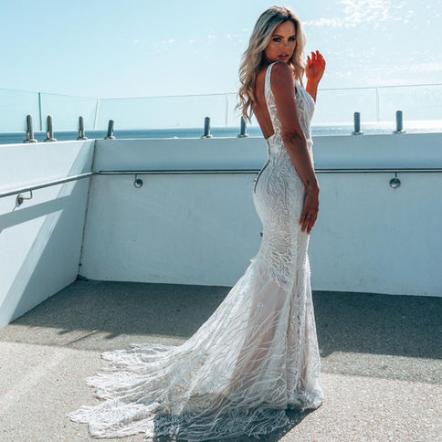 Mermaid couture wedding dress with straps and a low back