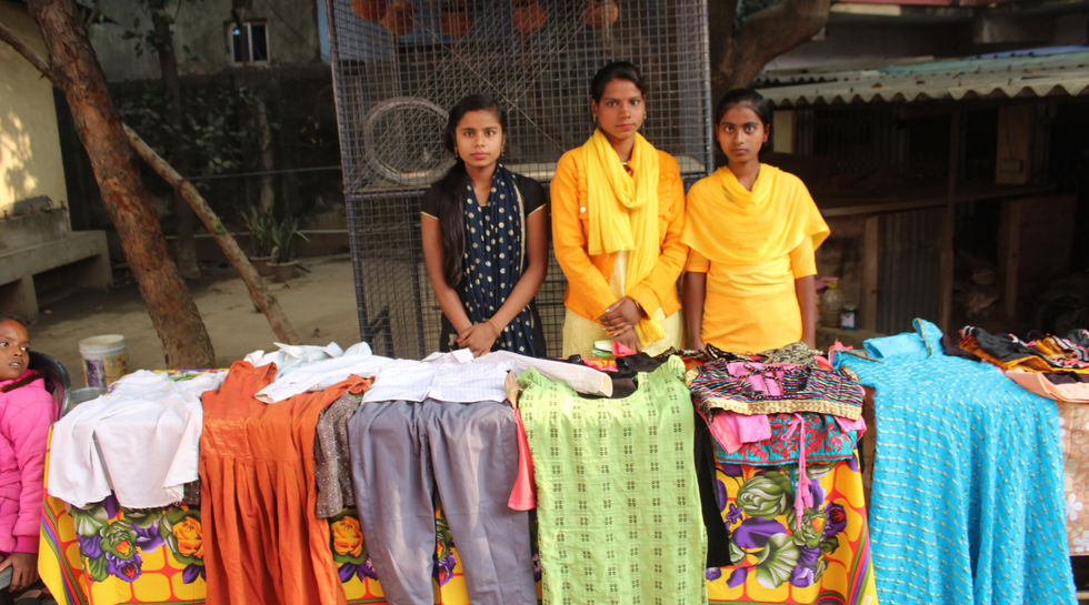 Adolescent Girls Day Tailoring students with their products.JPG