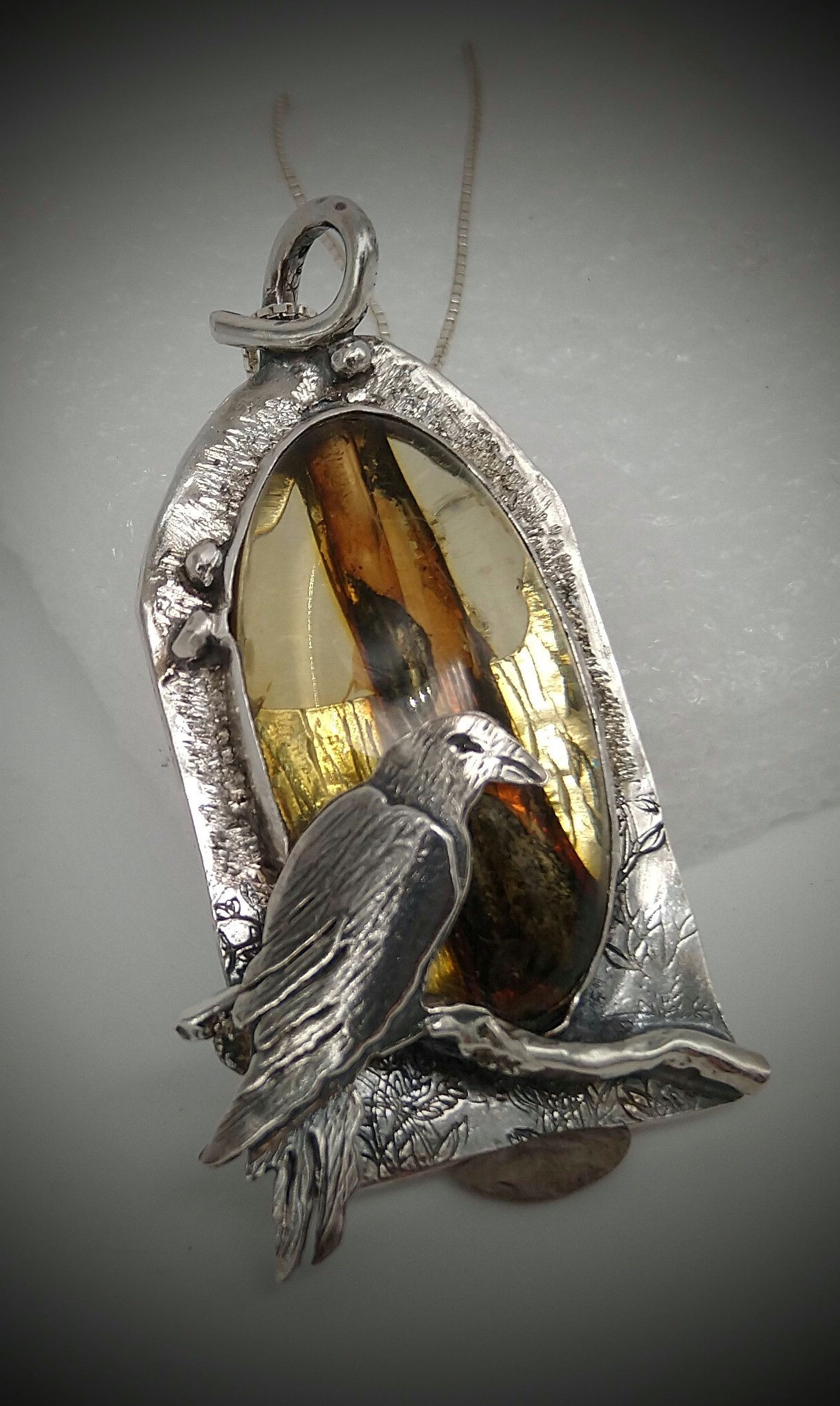 Sterling Silver Raven Pendant with Natural Amber