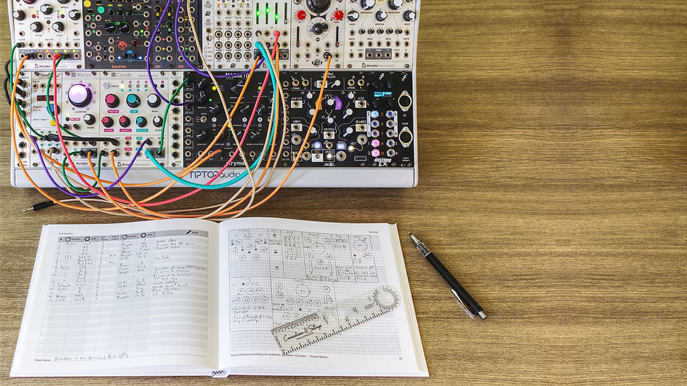 Connection & Settings journal with template tool, pages filled out with patch information, positioned in front of a  Eurorack modular synthesizer setup.