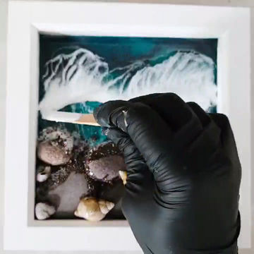 A video of the creation process of making the framed ocean resin art.