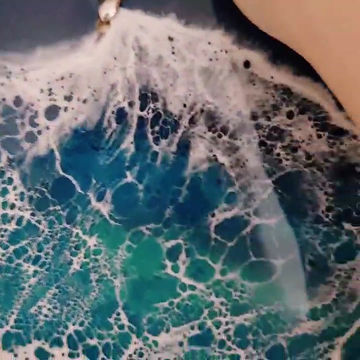 Thumbnail: A video of the two deep blue ocean resin hearts.