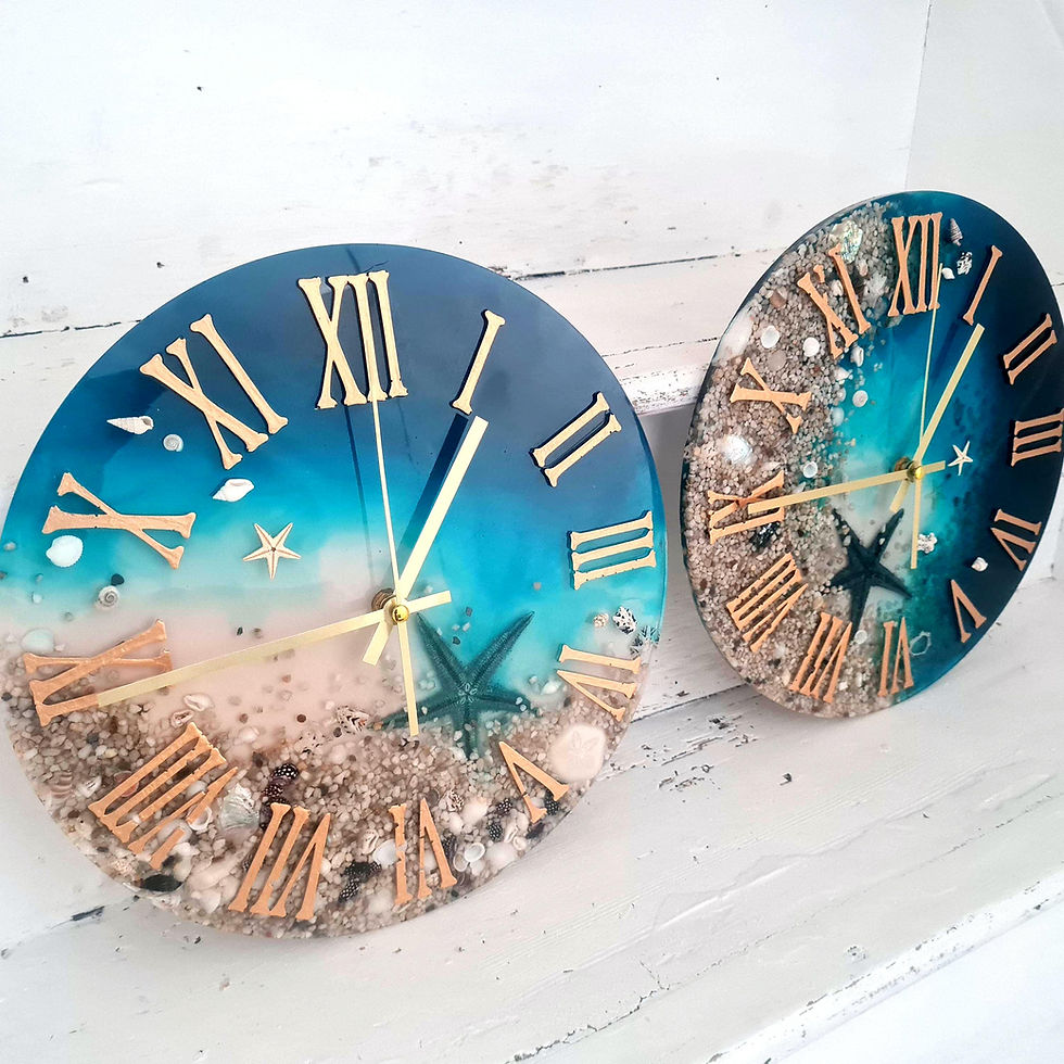 Thumbnail: Two similar looking epoxy ocean clocks stood side by side.