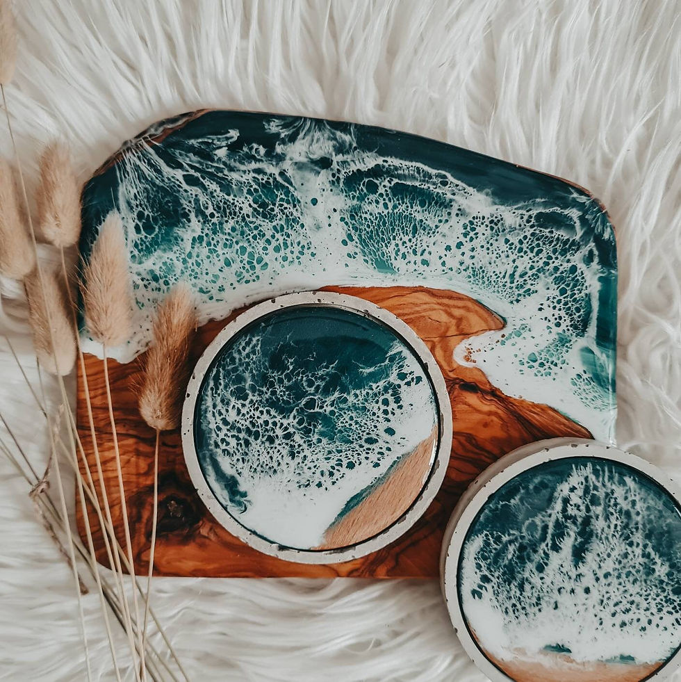 Thumbnail: Two ocean resin concrete coasters side with a olive wood ocean resin board. The two compliment each other.