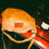 Thumbnail: A Marc By Marc Jacobs Leather Hobo Brown Handbag on the roof of a car next to a bottle of French champagne