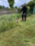 Chris baker trimming the overgrown grass in preparation for mowing