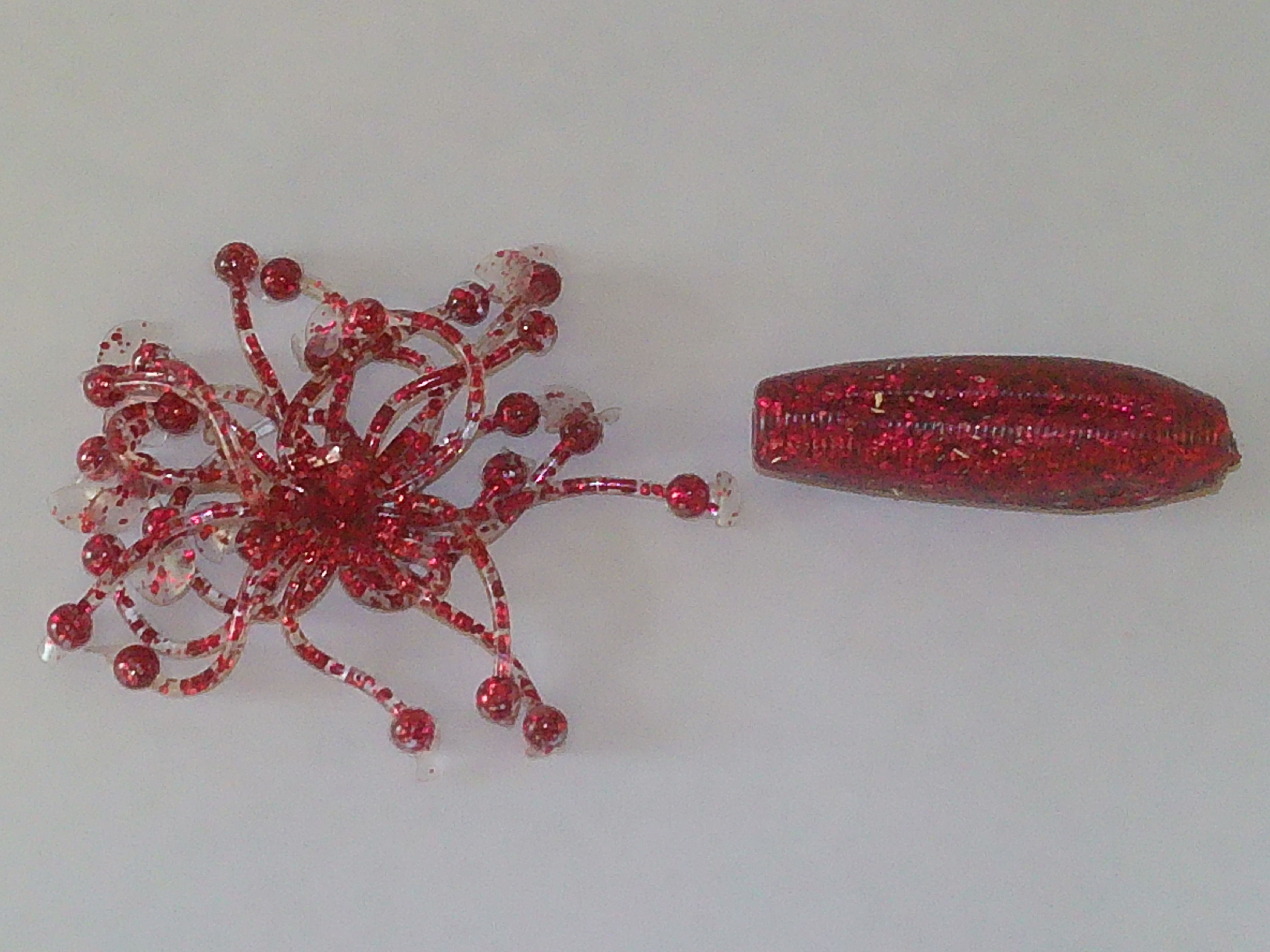 skirted soft fishing bait in red