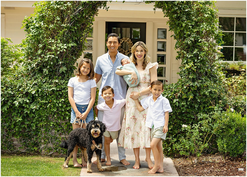 Family portrait in the front yard of their Arcadia home. Photo by Scottsdale photographer Jennifer Bowen