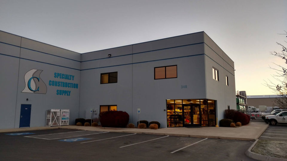 Dynamic Construction Corp building exterior at dusk