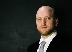 Portrait Countertenor ERIC JURENAS -formal dress and tie.
