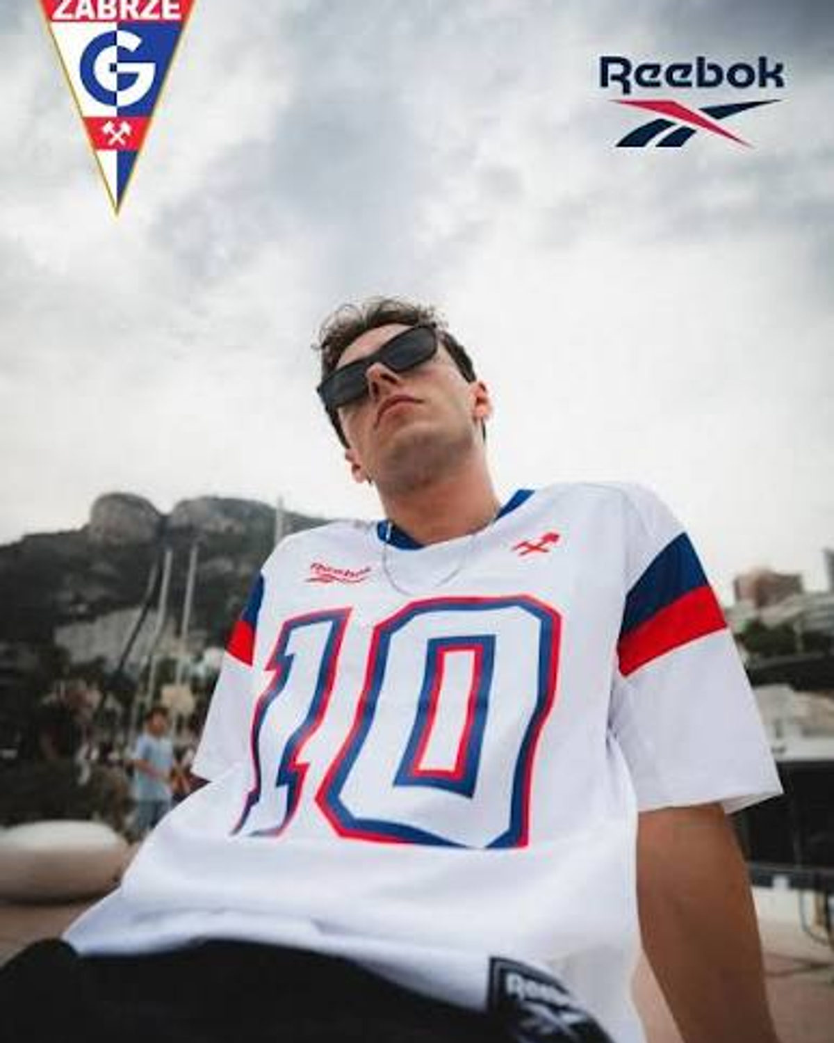 Model in white heritage jersey with large number 10