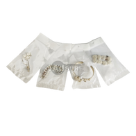 Clear accessory auto-bags packaging jewelry and hair clips for retail display.