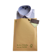 Recyclable Kraft paper auto-bag packaging a shirt for eco-friendly fulfillment.