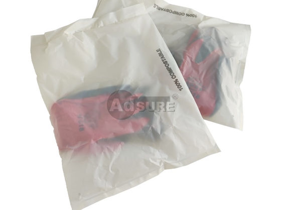 Biodegradable white compostable bags with vent holes packaging red gloves, printed with 100% compostable label