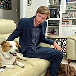 Jonathan on the couch with his dog
