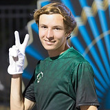 Jonathan in his marching band uniform smiling and showing a peace sign