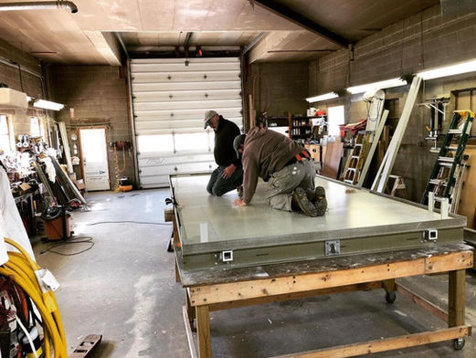 OpBox Team Assembling Construction Panels From Recycled Bottles