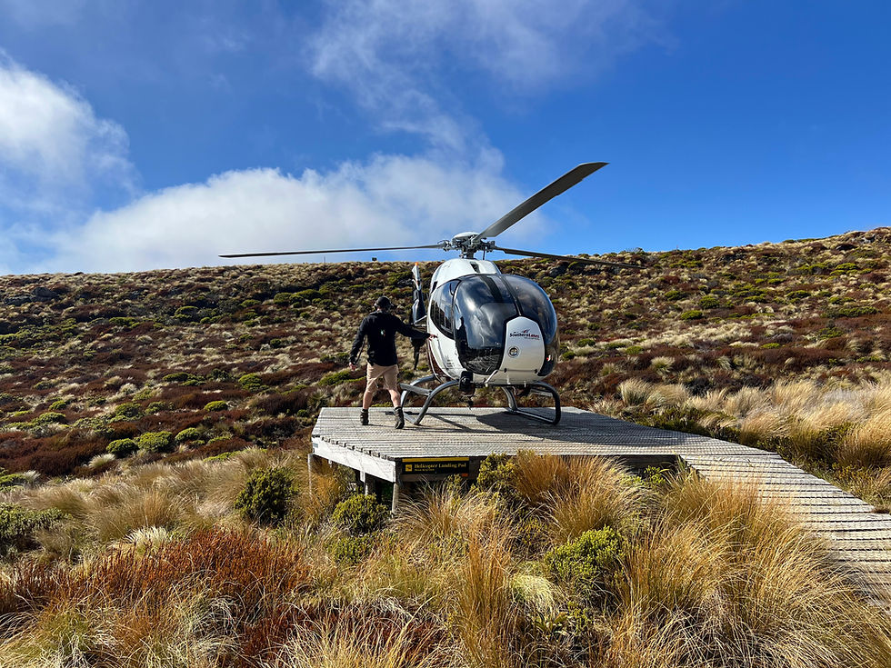 Helicopter landed at Luxmore Hut