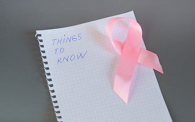 Things to know is written in Notepad with pink ribbon awareness breast cancer..jpg