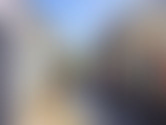 girl in a hat walking down a colorful street