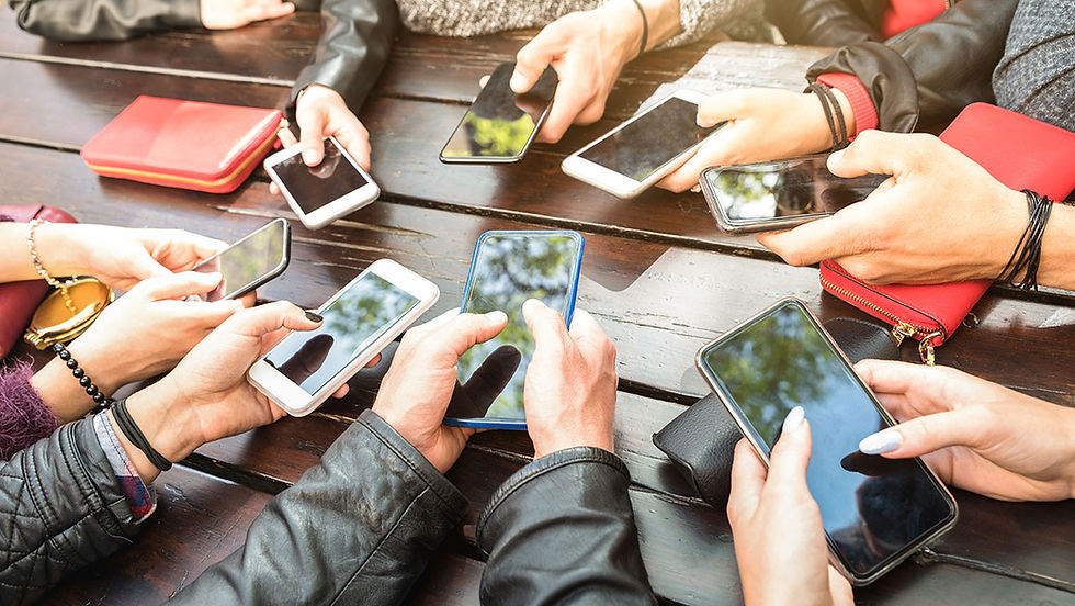 Teens holding cell phones