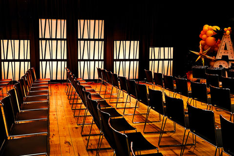 Special event setup with large portable backdrop panels and books on a shelf cover set. 