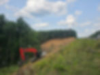 Link-Belt excavator clearing and grading a steep highway right-of-way in Virginia.