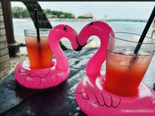 drinks served in floating flamingos in Aruba