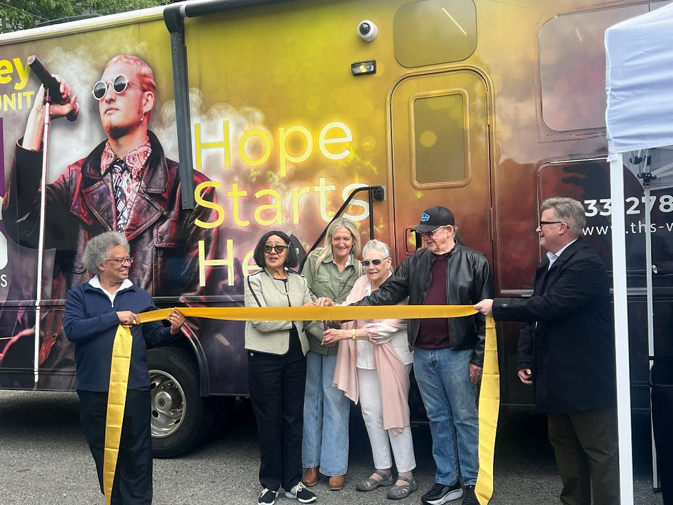 Layne Staley's family and THS CEO Patricia Edmond-Quinn cut the ribbon to open new Mobile Medical Unit
