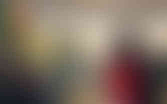 a lady and her child pay their respects and contributions to the altar