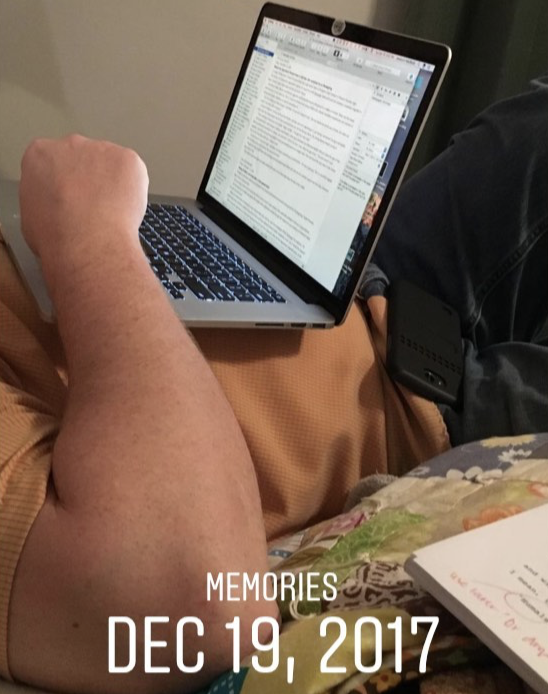 Person reclining with a laptop on their lap, with MEMORIES DEC 19, 2017 overlaid at the bottom.