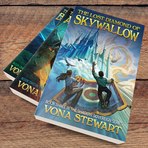 Three fantasy paperback books on a wooden table, including The Lost Diamond of Skywallow - the new release from Vona Stewart in the Shadow Sovereign series.