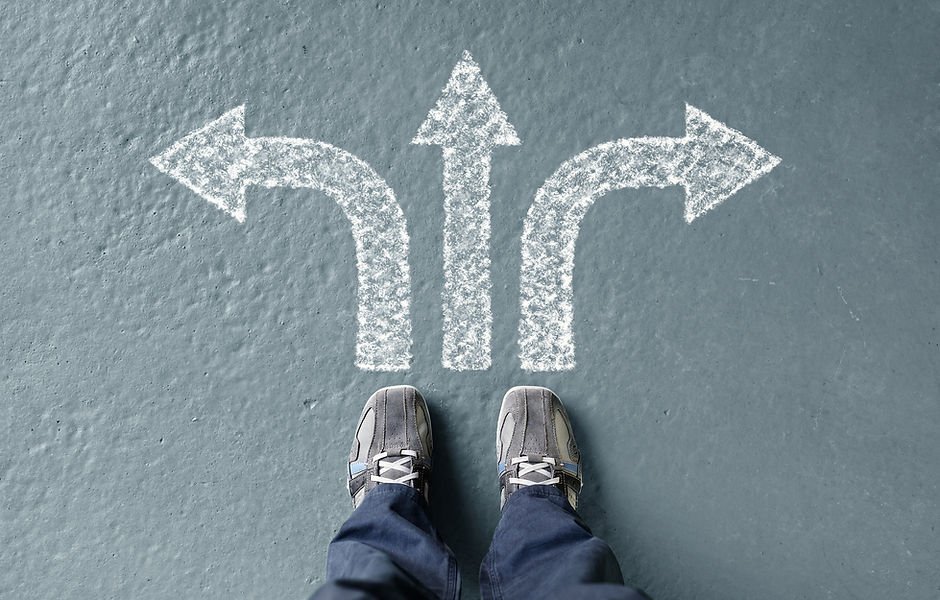 Taking decisions for the future man standing with three direction arrow choices, left, right or move