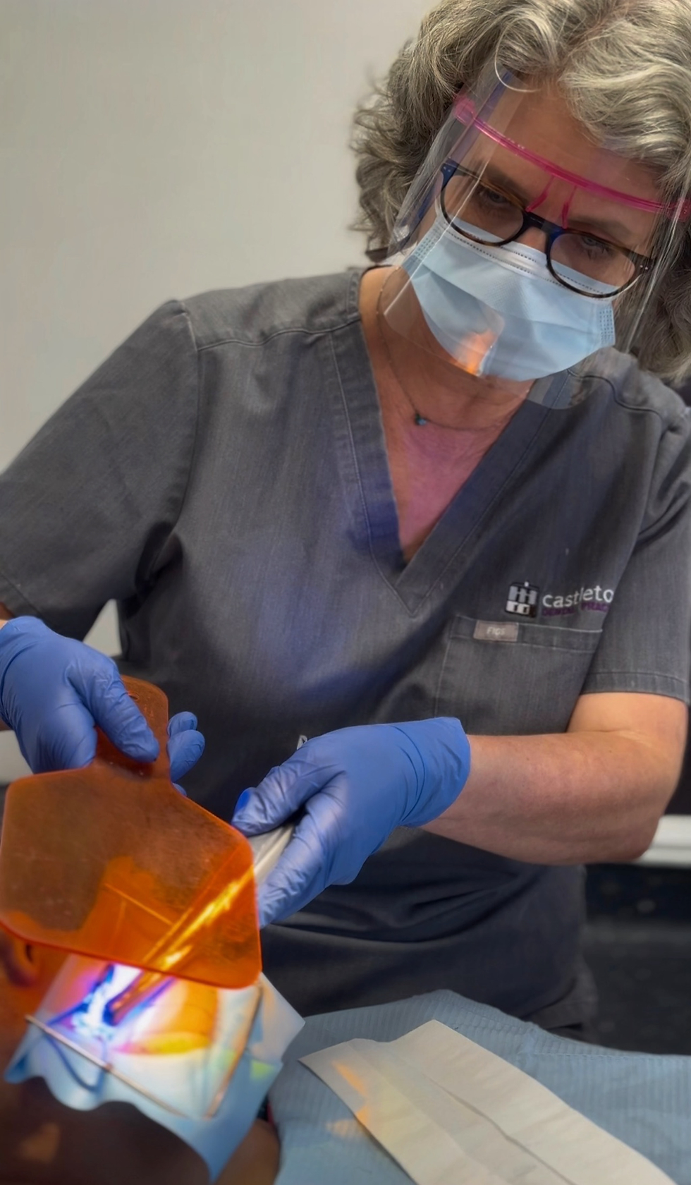 Dental nurse Nicky wearing PPE while treating a patient