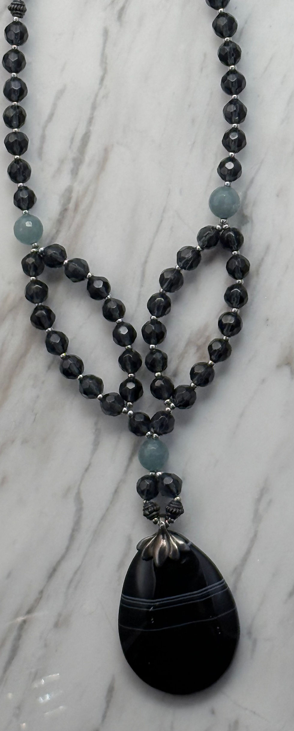 Thumbnail: Black Necklace Showcasing Pendant
