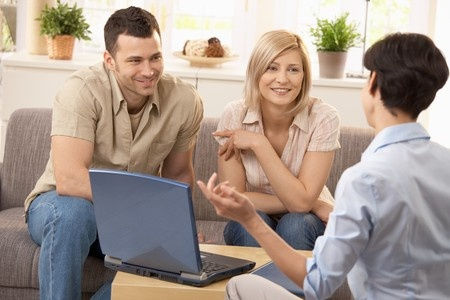 A couple talking to a woman