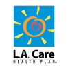 Orange circle with heart within and sun rays, all on blue background