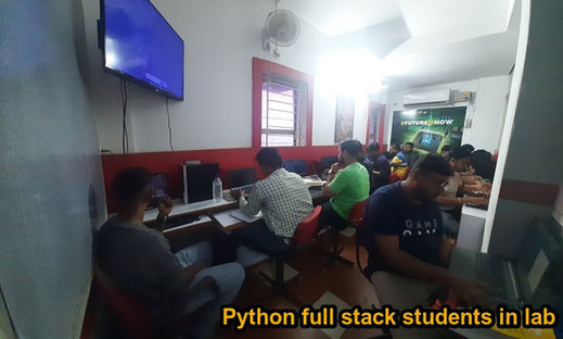 Python full stack development students studying and practicing coding in a computer lab.
