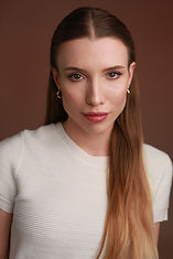 Emily-Headshot-White-2.jpg