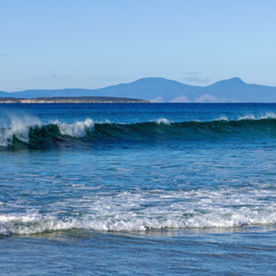 The beach with crashing waves.