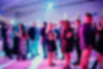 People standing and mingling in the event space.