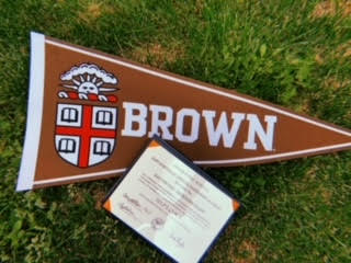 Brown University Flag laying in the grass