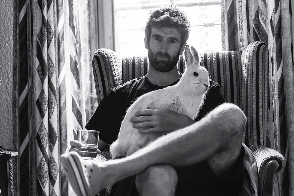 Mike sat in a chair in an old hotel in Switzerland.