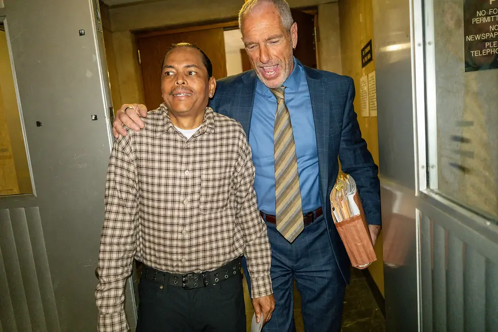 Scotty Enoe, the CVS worker initially accused of murder after a stabbing incident with a shoplifter, is seen leaving the courthouse relieved as charges are dropped.