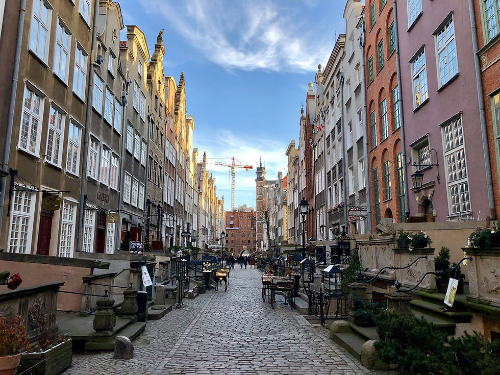 Historic Mariacka Street in Gdańsk with amber shops and stone terraces.
