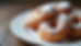 Close-up view of traditional Polish pączki doughnuts dusted with powdered sugar
