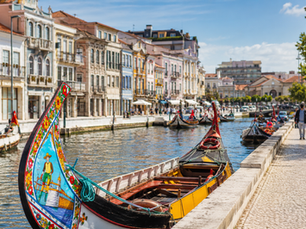 Colourful moliceiro boats on the canal in Aveiro, Portugal