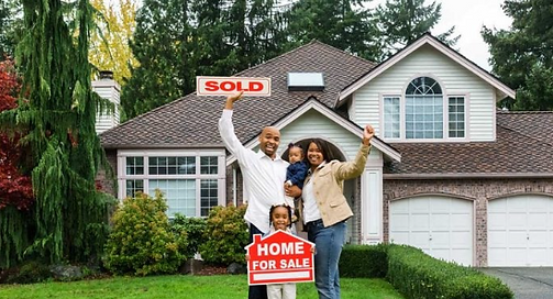 Family standing in front of their home while learning about term life insurance and how it protects mortgage payments.